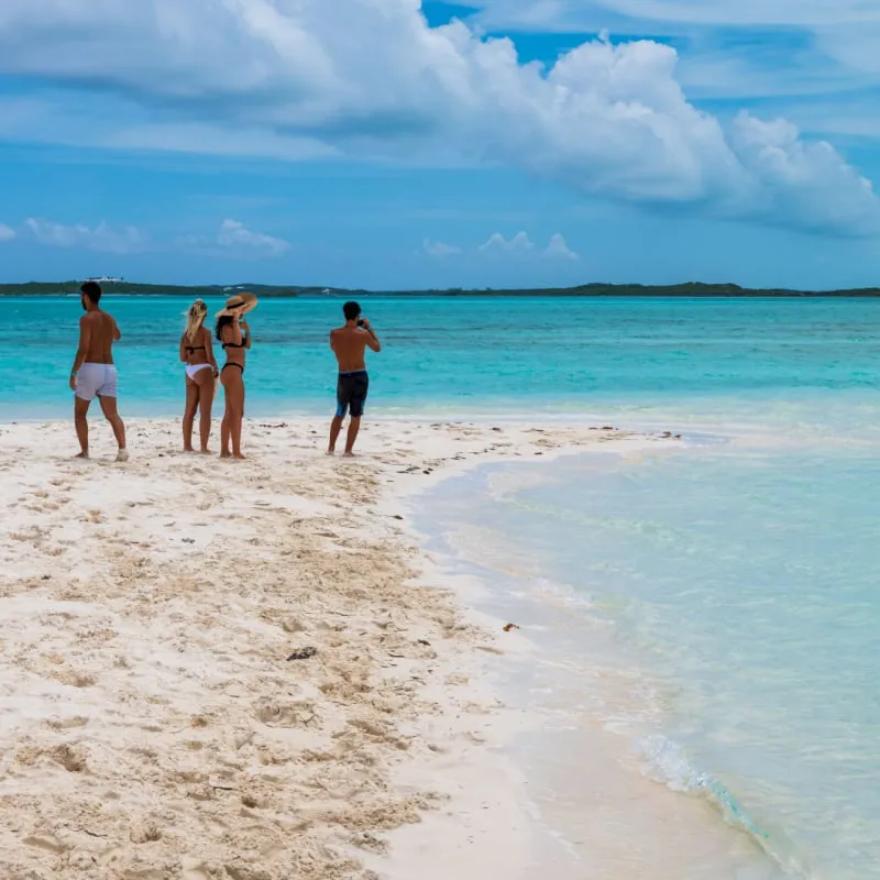 Tourists on a sandbank in Great Exuma, Bahamas