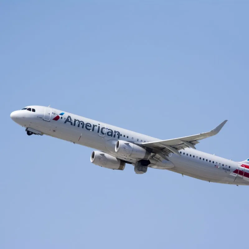 american airlines plane flying, clear sky