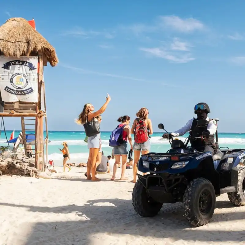 Cancun Police Patroling Beach, Mexico