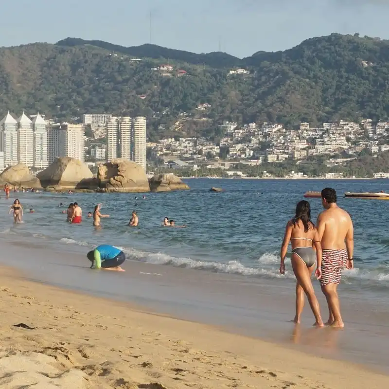 Beachgoers Enjoying A Beach Day In Acapulco, Mexico