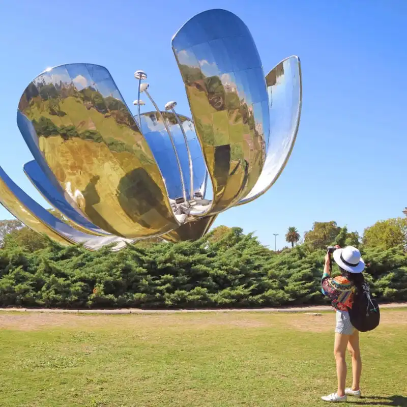 woman taking photo of floralis generica in buenos aires argentina